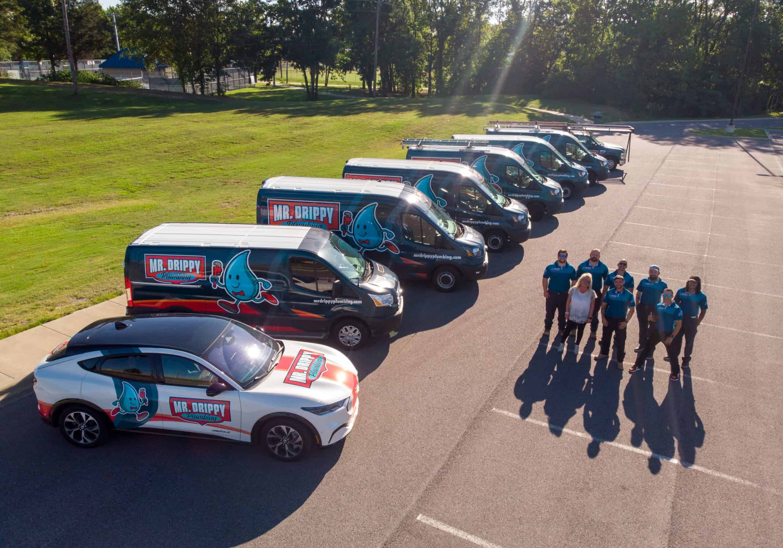 Mr Drippy Plumbing Team with vans